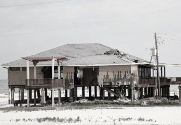 Wind damage - spray foam can help prevent uplift to Laredo roofs